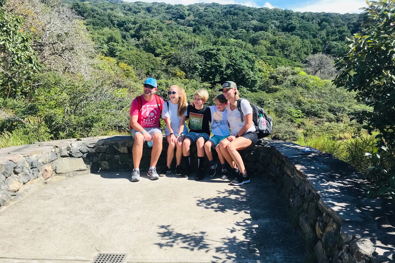 Capturing priceless memories with the stunning Rincon de la Vieja Volcano as a backdrop. Cherishing this special moment with family amidst the beauty of nature on a volcanic hike.